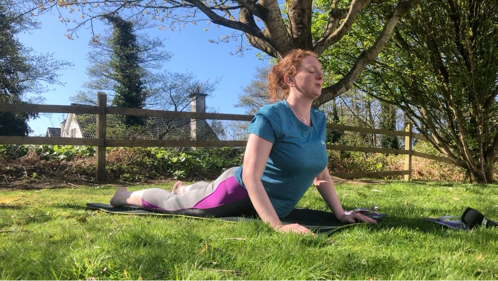 Yoga Instructor demonstrating the cobra posture